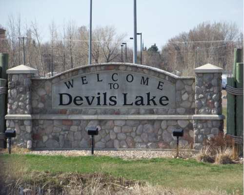 Brick Monument that says "Welcome to Devils Lake"
